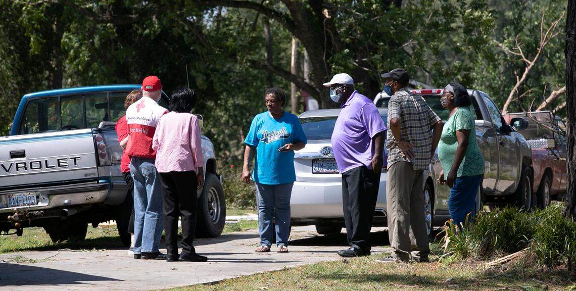Brenda Wilson, center, talks with the American Red Cross in front of her home at 231 Woodard Road in rural Bertie County on Tuesday, August 4, 2020. Early Tuesday a tornado from Hurricane Isaias moved through Bertie County damaging her home.