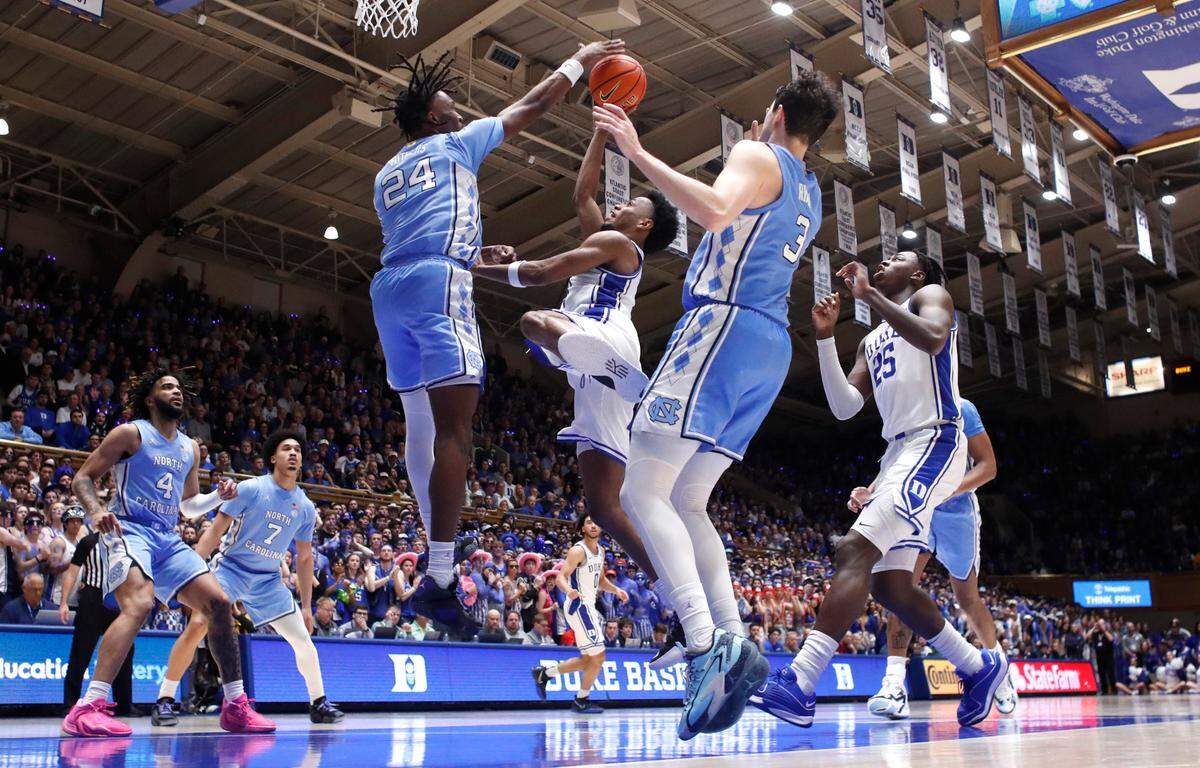 North Carolina’s Jae’Lyn Withers (24) blocks the shot by Duke’s Jeremy Roach (3) during UNC’s 84-79 victory over Duke at Cameron Indoor Stadium in Durham, N.C., Saturday, March 9, 2024.