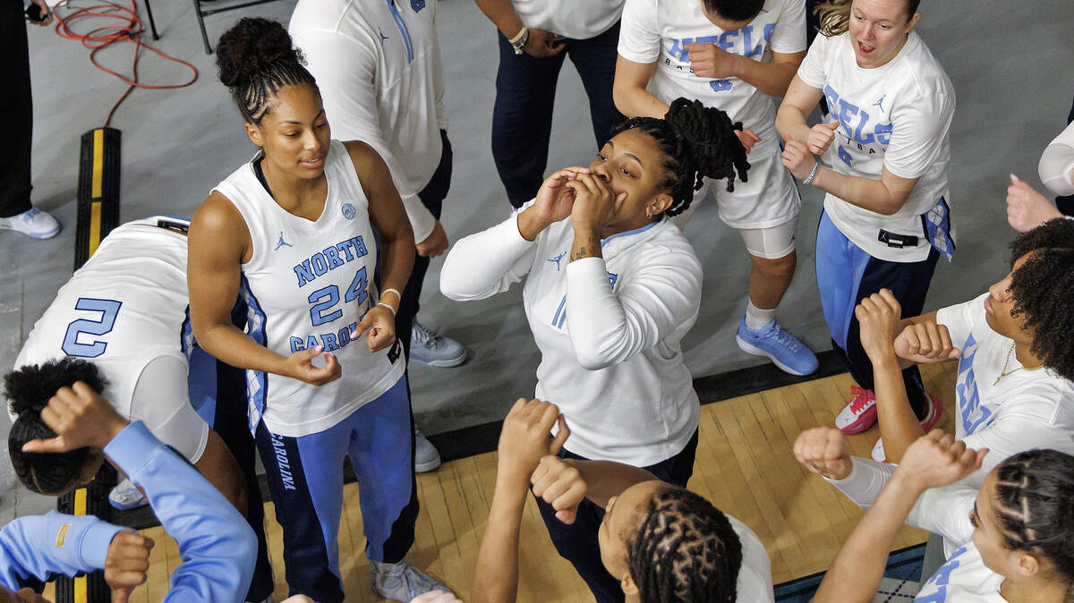 North Carolina Student Assistant Kayla McPherson, center, leads a huddle prior to the Tar Heels’ game against Duke on Sunday, March 1, 2026, at Carmichael Arena in Chapel Hill, N.C.