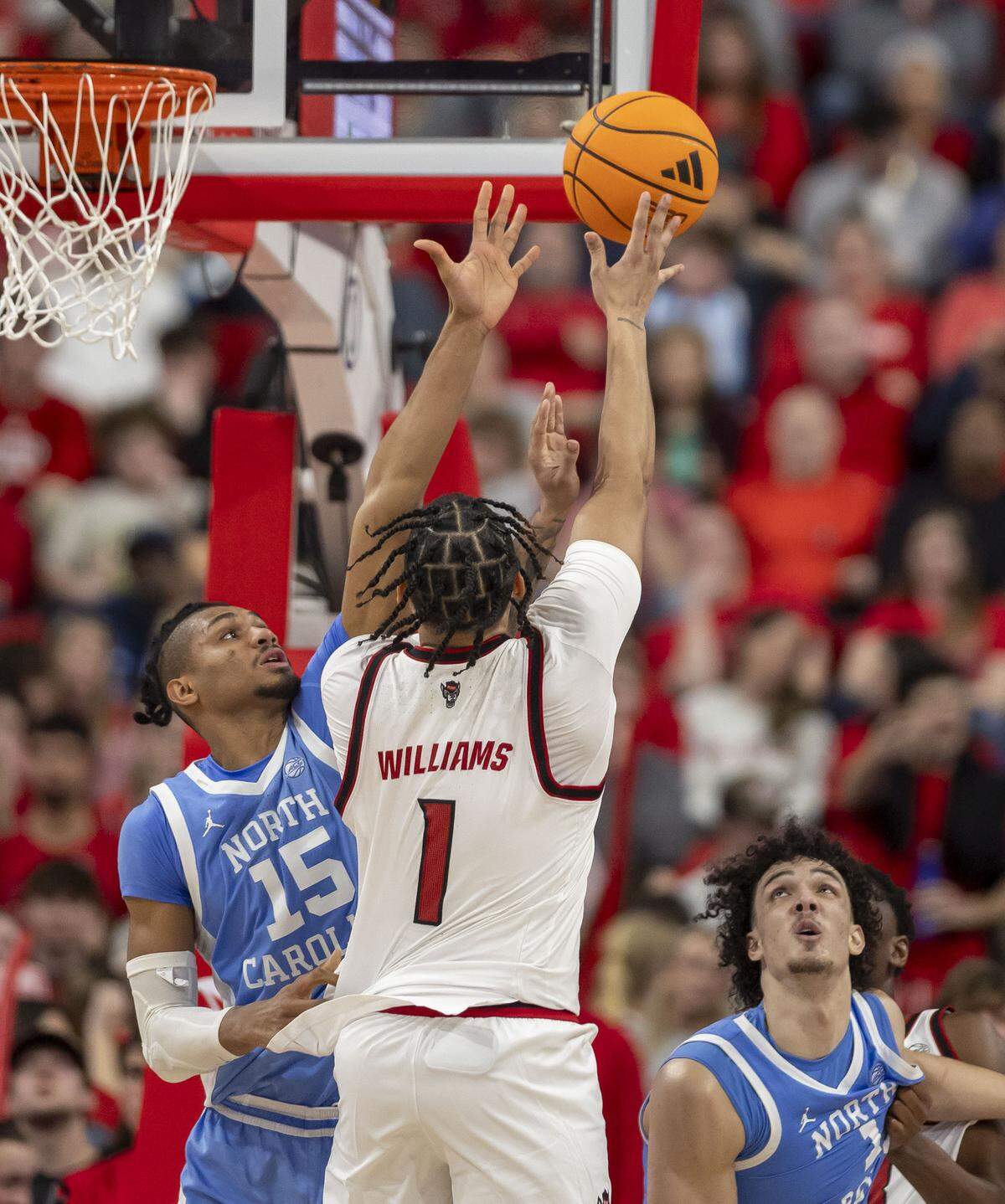 North Carolina forward Jarin Stevenson (15) defends N.C. State forward Darrion Williams (1) in the second half on Tuesday, February 17, 2026 at Lenovo Center in Raleigh, N.C.