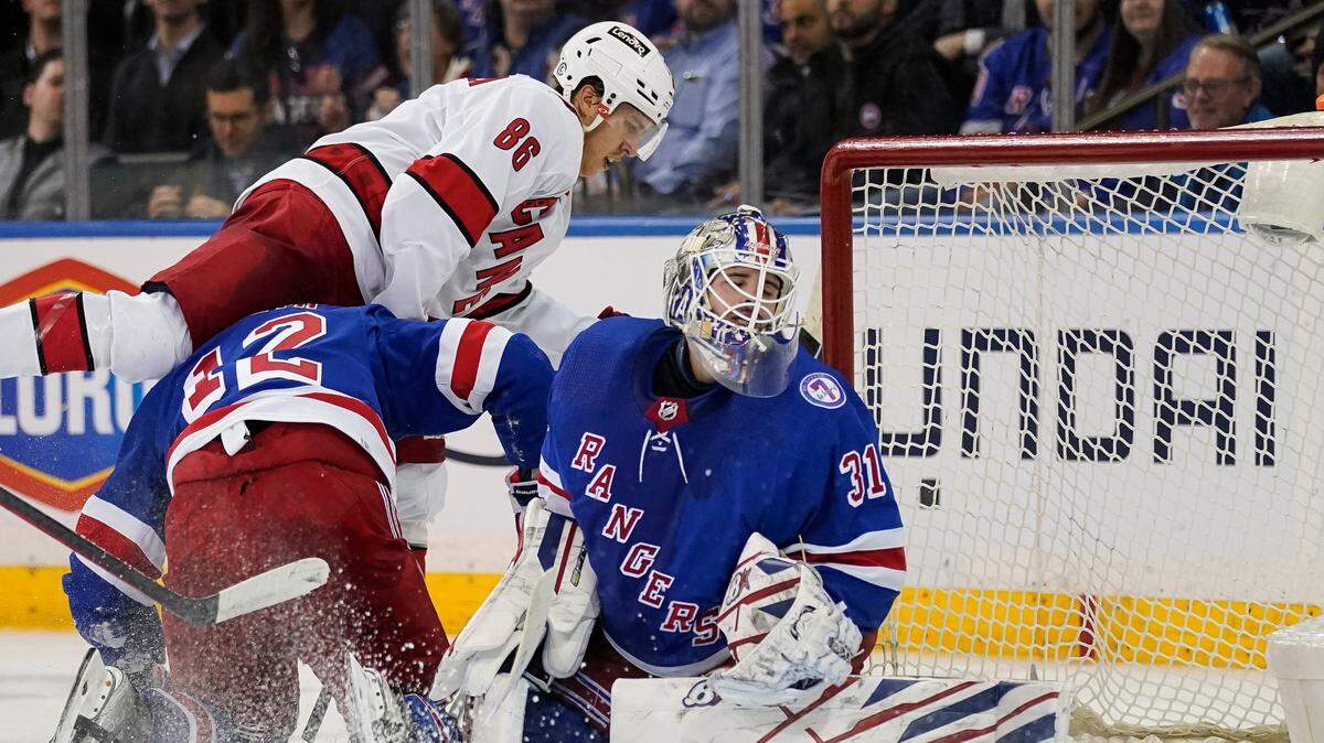 Carolina Hurricanes left wing Teuvo Teravainen (86) scores on New York Rangers goaltender Igor Shesterkin (31) during the second period of an NHL hockey game, Tuesday, April 26, 2022, in New York. (AP Photo/John Minchillo)