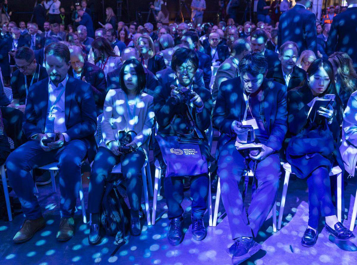 Media members are bathed in polka-dotted lights as they await the start of the program, during a celebration of production at Toyota’s $13.9 billion battery plant on Wednesday, November 12, 2025 in Liberty, N.C. 