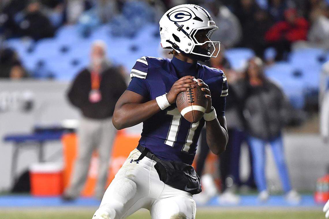 Grimsley quarterback Faizon Brandon looks to pass downfield  against Clayton during the first half.  The Clayton Comets and the Grimsley Whirlies met in the NCHSAA 7A football Championships in Chapel Hill, North Carolina, on Dec. 12, 2025.