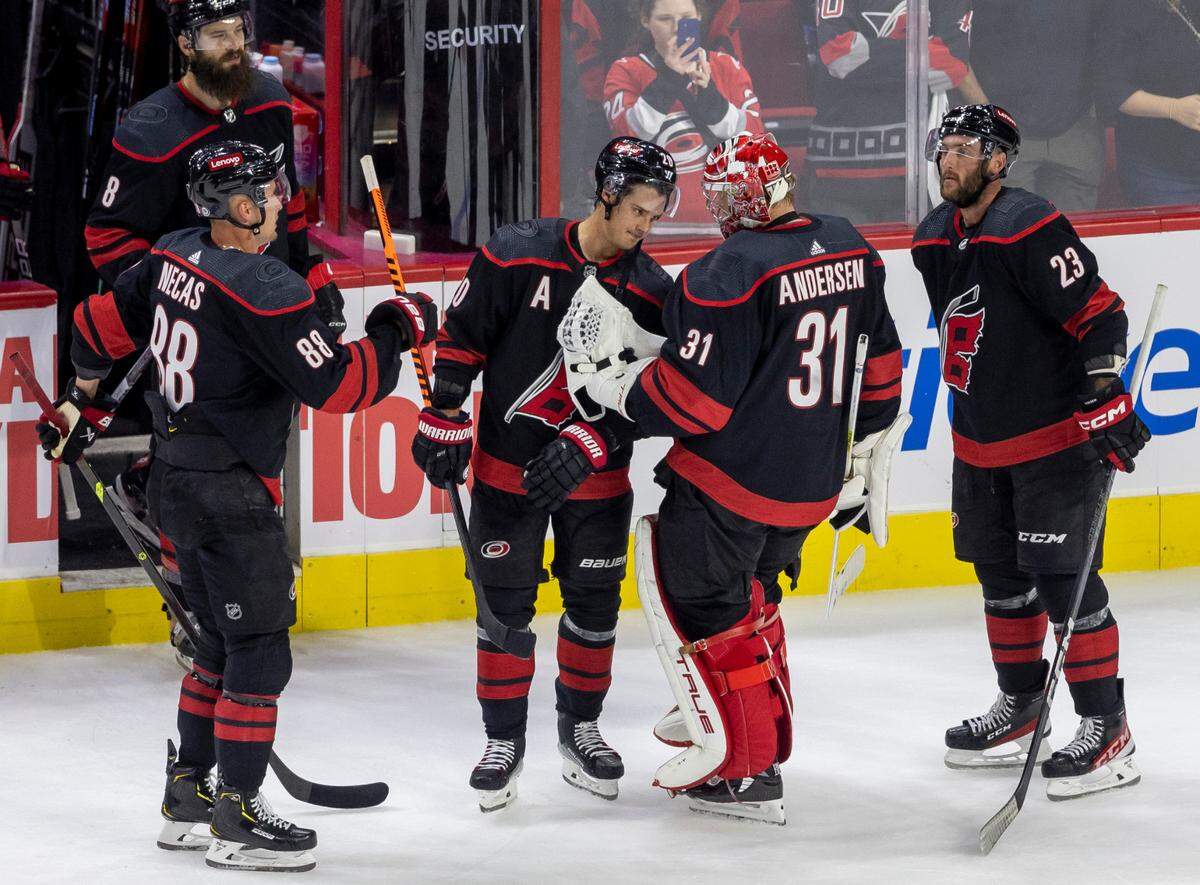 The Carolina Hurricanes Sebastian Aho (20) congratulates goalie Frederik Andersen (31) following their victory over Ottawa on Wednesday, October 11, 2023 at PNC Arena, in Raleigh N.C. Andersen made 27 saves in the Hurricanes’ 5-3 victory.