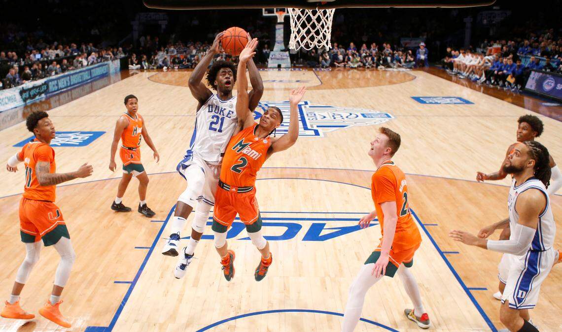Duke’s A.J. Griffin (21) drives to the basket against Miami’s Isaiah Wong (2) in the first half during the semi-finals of the ACC Tournament on Friday, March 11, 2022 at Barclays Center in Brooklyn, N.Y.