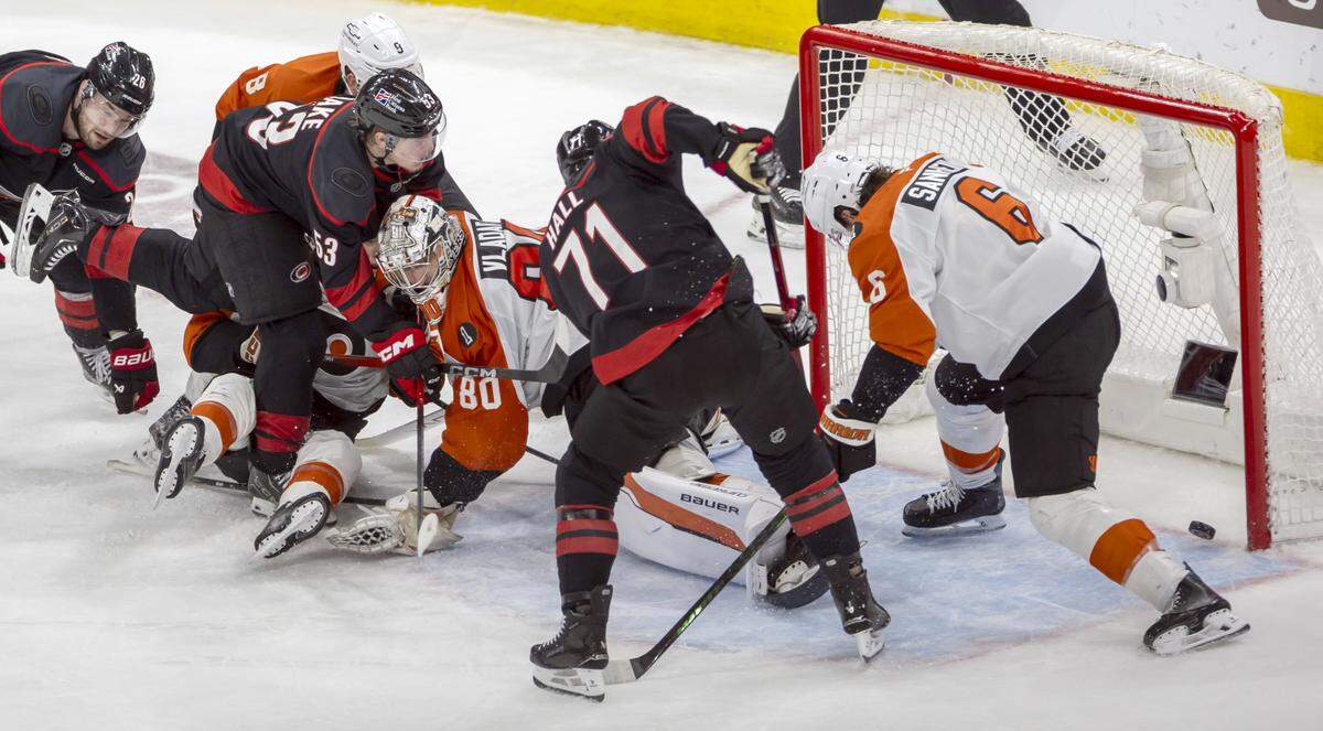 Carolina Hurricanes left wing Taylor Hall (71) scores the game winning goal on Philadelphia goalie Dan Vladar (80), to secure a 3-2 overtime victory, in Game 2 on Monday, May 4, 2026, during the second round of the Stanley Cup Playoffs at Lenovo Center in Raleigh, N.C.