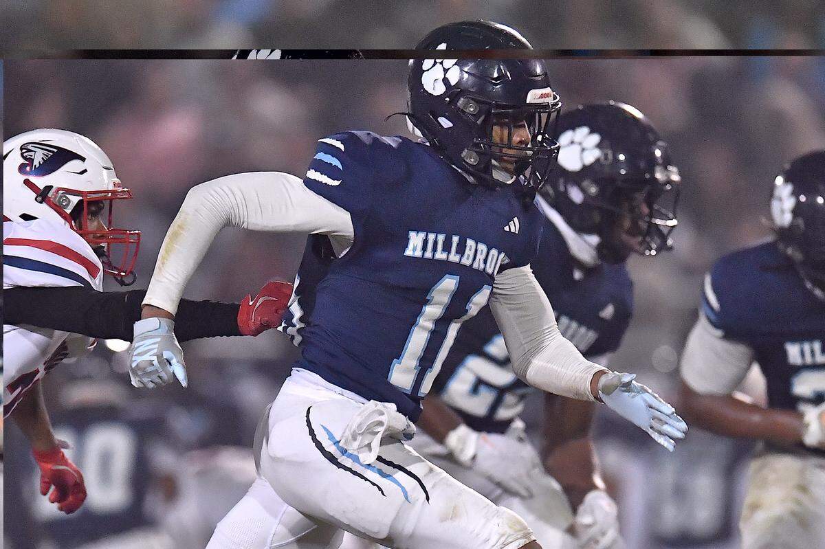 Millbrook strong safety Cairo Williams (11) sprints downfield towards the missed punt from Jordan during the first half. The Millbrook Wildcats and the Jordan Falcons met in the third round of the NCHSAA 8A football playoffs in Raleigh, N.C. on November 21, 2025. 