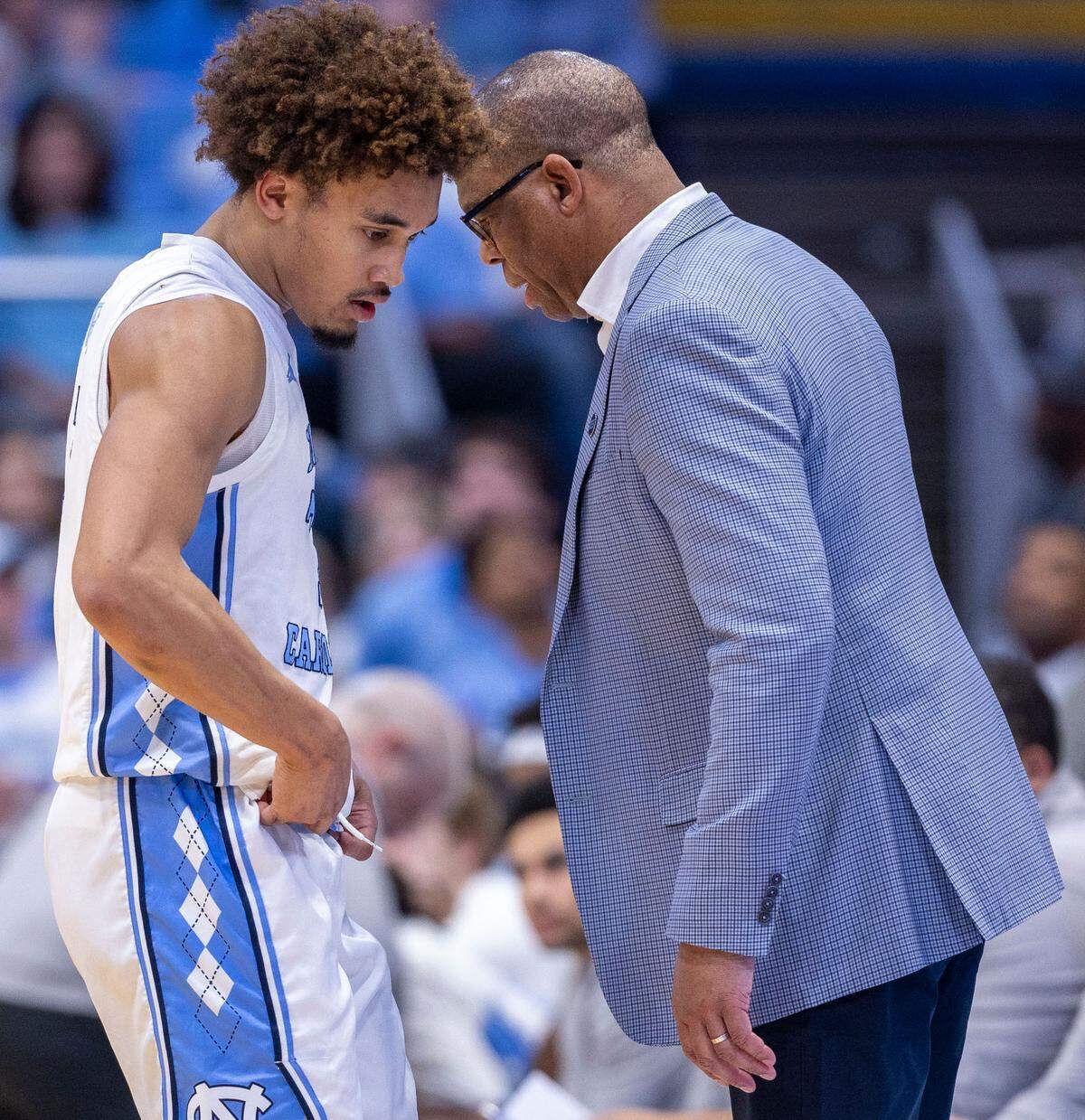 North Carolina coach Hubert Davis talks with North Carolina guard Seth Trimble (7) in the first half on Saturday, January 25, 2025 at the Smith Center in Chapel Hill, N.C.