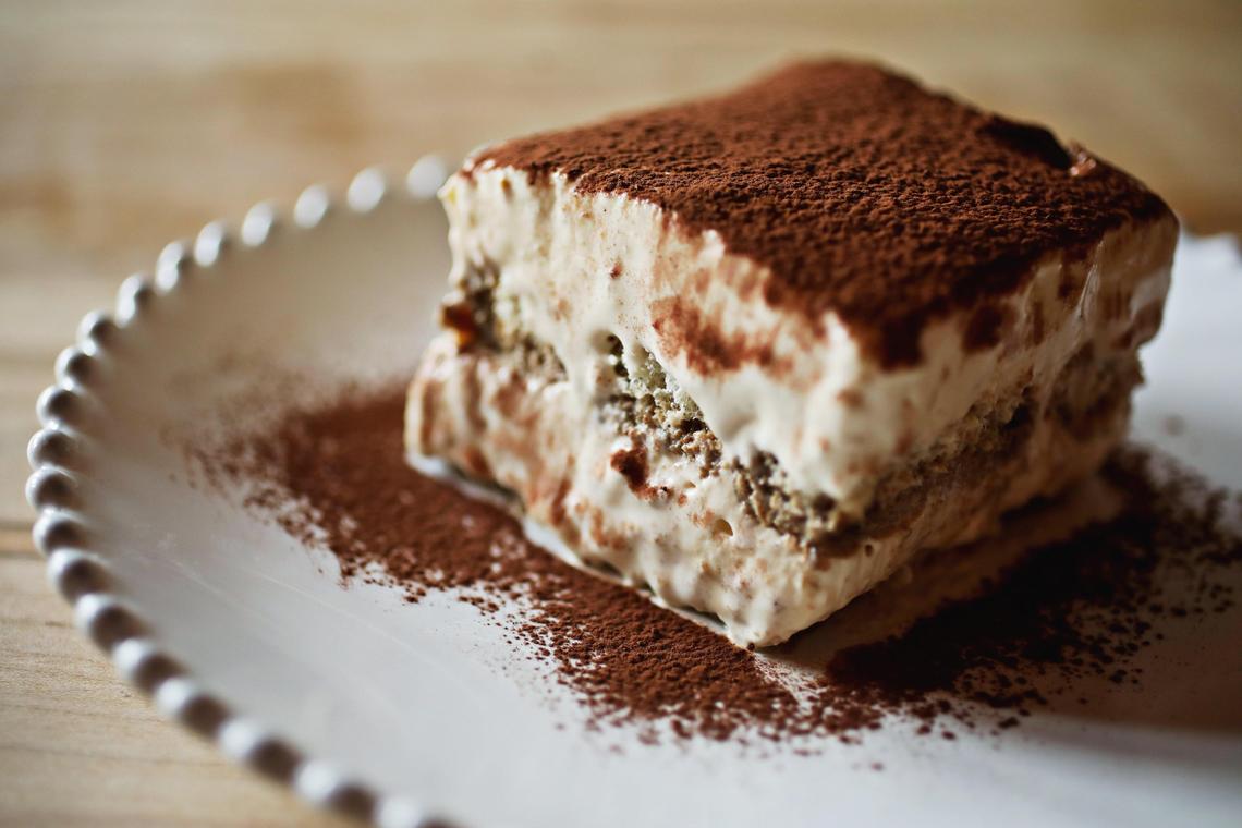 Cucciolo Osteria’s coffee-soaked ladyfingers are nestled between layers of marsala-sweetened mascarpone in a pillowy, cocoa-dusted tiramisu.