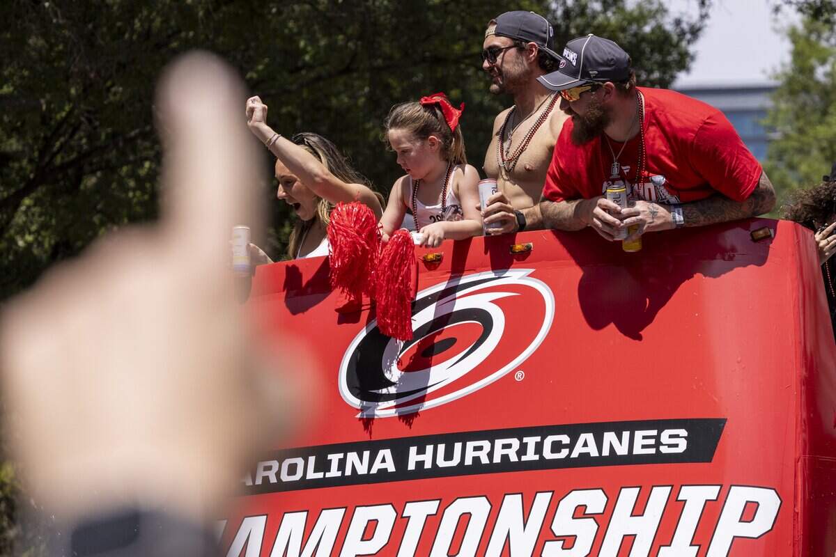Thousands of Carolina Hurricanes fans gather in downtown Raleigh on Saturday, June 20, 2026, during a parade and rally celebrating the Hurricanes' Stanley Cup Final victory over the Vegas Golden Knights. The Hurricanes won the series 4-2 to capture the Stanley Cup for the second time since 2006.