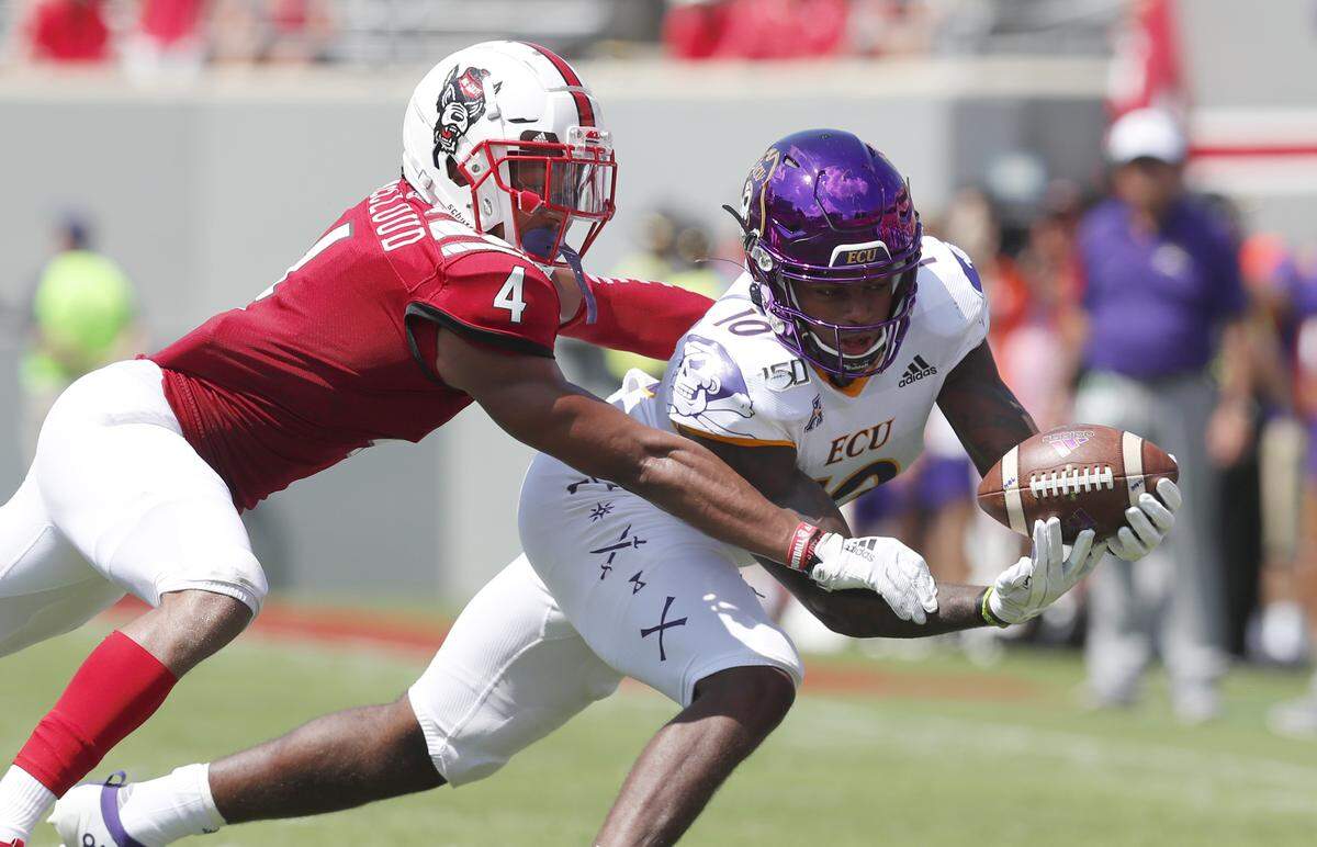 N.C. State cornerback Nick McCloud (4) breaks up a pass intended for East Carolina wide receiver Leroy Henley (10) during the second half of N.C. State’s 34-6 victory over East Carolina University at Carter-Finley Stadium in Raleigh, N.C., Saturday, August 31, 2019.