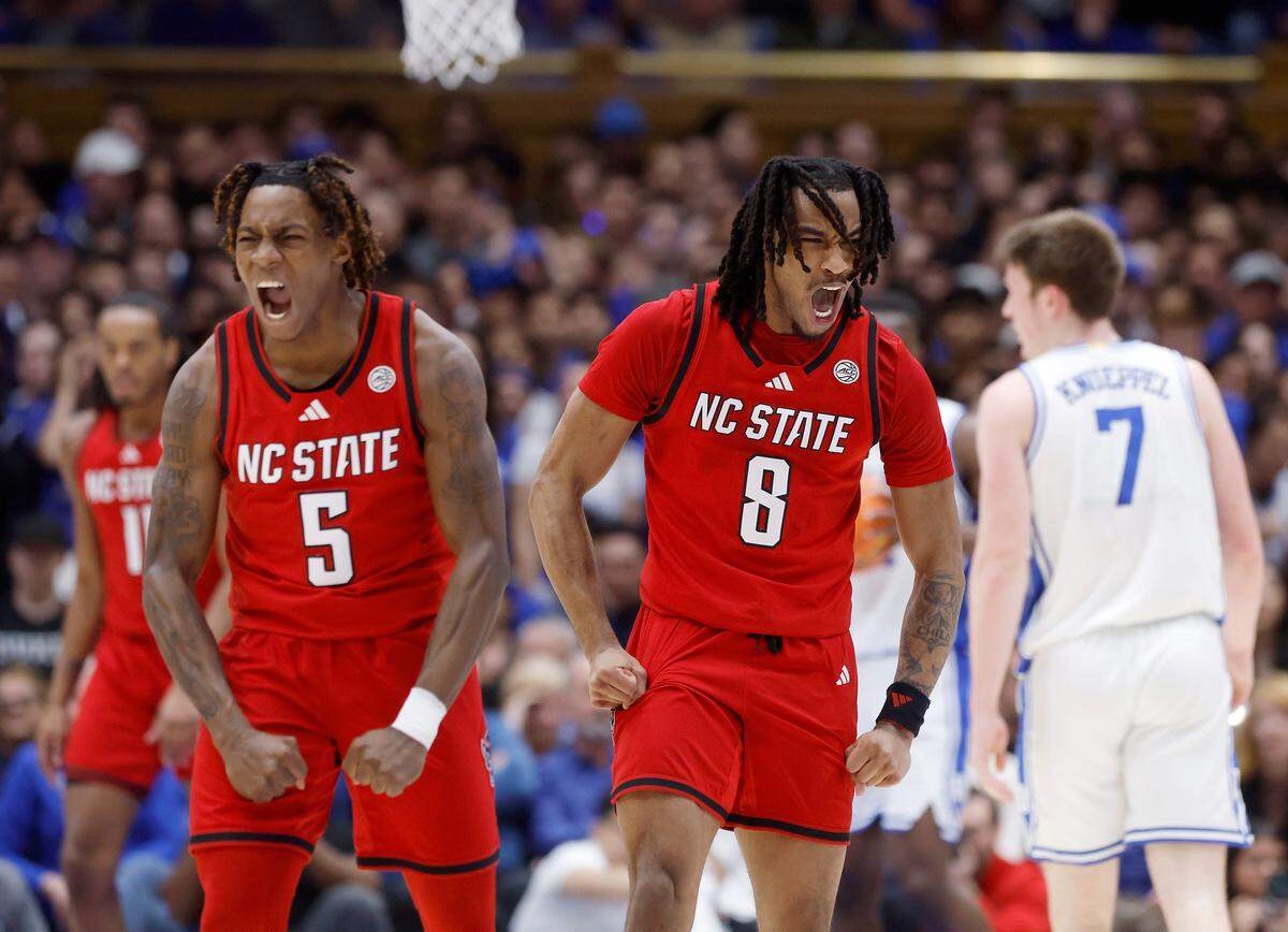 N.C. State’s Trey Parker and Jayden Taylor react after a Wolfpack basket during the first half against Duke on Monday, Jan. 27, 2025, at Cameron Indoor Stadium in Durham, N.C.