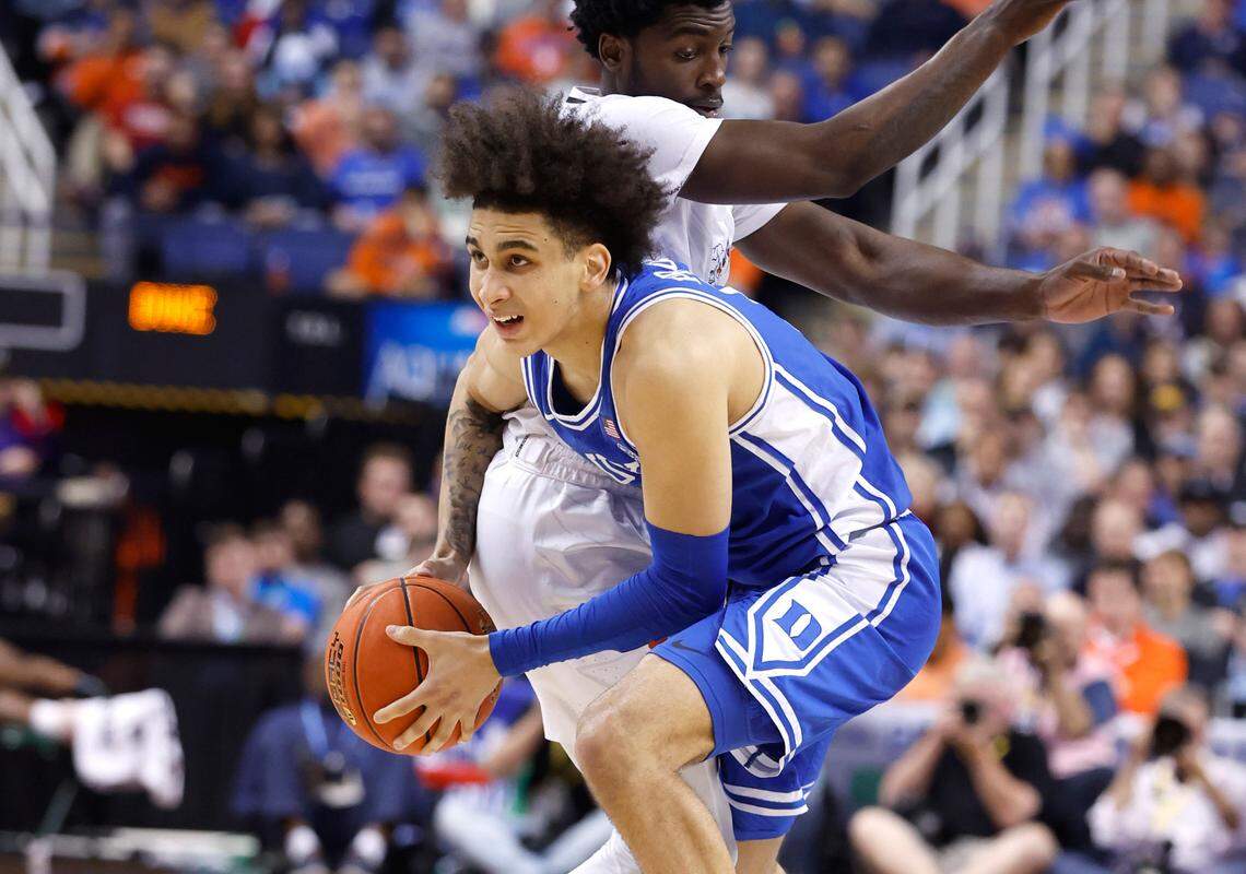 Duke’s Tyrese Proctor (5) escapes the pressure by Miami’s Bensley Joseph (4) during the second half of Duke’s 85-78 victory over Miami in the semifinals of the ACC Men’s Basketball Tournament in Greensboro, N.C., Friday, March 10, 2023.