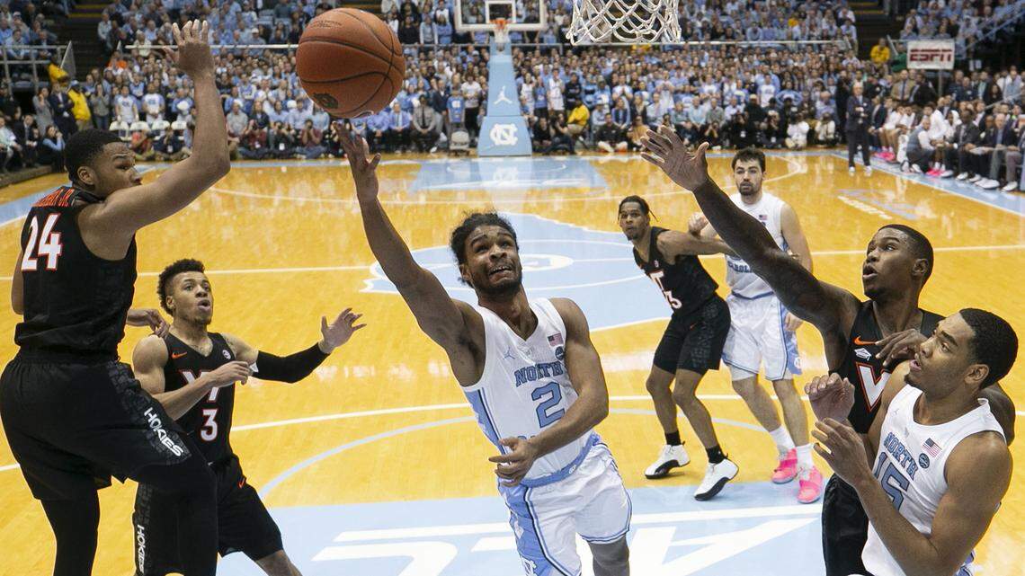 North Carolina’s Coby White (2) breaks to the basket between the Virginia Tech defense during the first half for two of his game high 27 points on Monday, January 21, 2019 at the Smith Center in Chapel Hill, N.C.