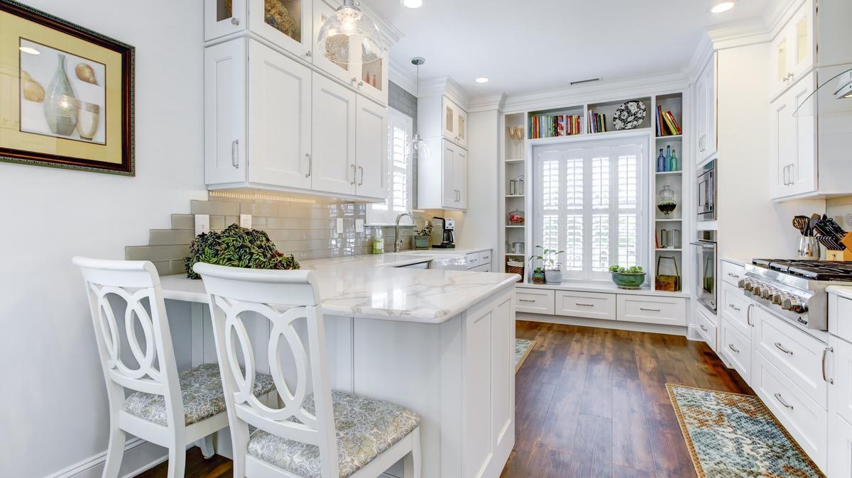 What was important here? Storage, storage, and more storage. That along with chef-level functionality and colors that reflect the homeowners' love of the beach.