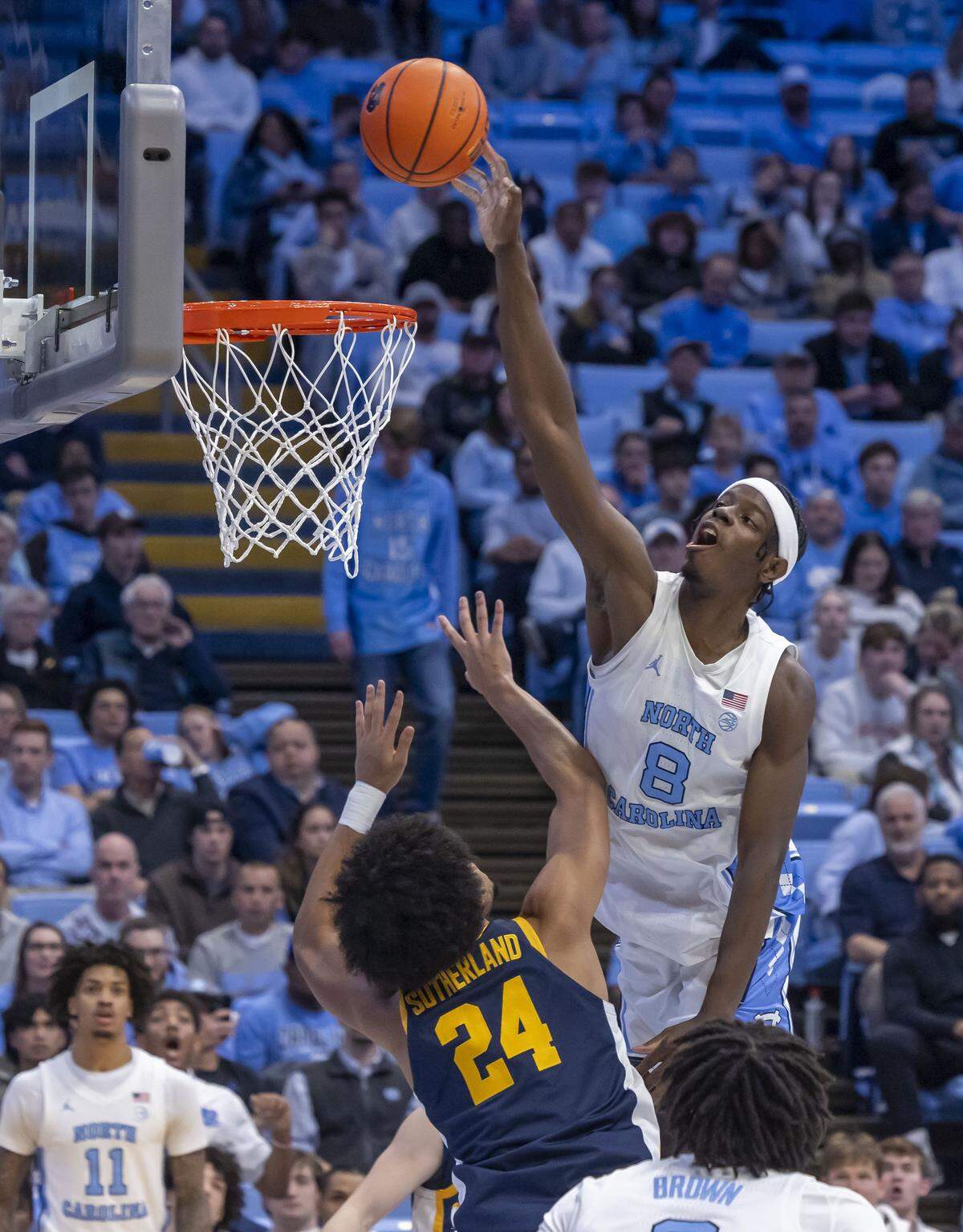 North Carolina forward Caleb Wilson (8) drives to the basket against East Tennessee State forward Isiah Sutherland (24) in the second half on Tuesday, December 16, 2025 at the Smith Center in Chapel Hill, N.C.