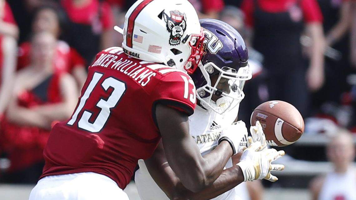 N.C. State’s Tyler Baker-Williams (13) breaks up a pass intended for Western Carolina wide receiver Daquan Patten (6) during the second half of N.C. State’s 41-0 victory over Western Carolina at Carter-Finley Stadium in Raleigh, N.C., Saturday, Sept. 7, 2019.