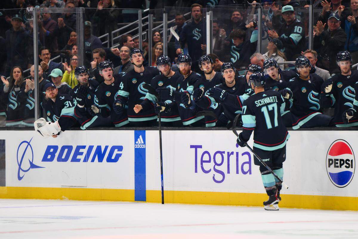 Oct 19, 2023; Seattle, Washington, USA; Seattle Kraken center Jaden Schwartz (17) celebrates with the bench after scoring a goal against the Carolina Hurricanes during the first period at Climate Pledge Arena. Mandatory Credit: Steven Bisig-USA TODAY Sports