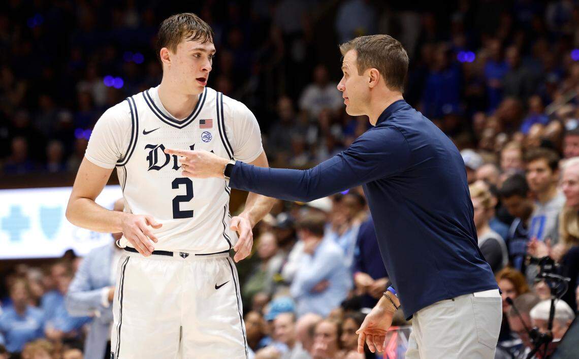 Duke head coach Jon Scheyer talks with Cooper Flagg (2) during the second half of Duke’s 87-70 victory over UNC at Cameron Indoor Stadium in Durham, N.C., Saturday, Feb. 1, 2025.