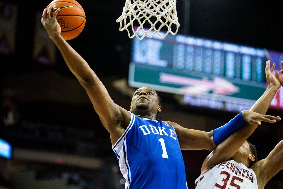 Duke guard Trevor Keels (1) holds off Florida State guard Matthew Cleveland (35) as he goes in for a lay up in the first half of an NCAA college basketball game in Tallahassee, Fla., Tuesday Jan. 18, 2022. (AP Photo/Mark Wallheiser)