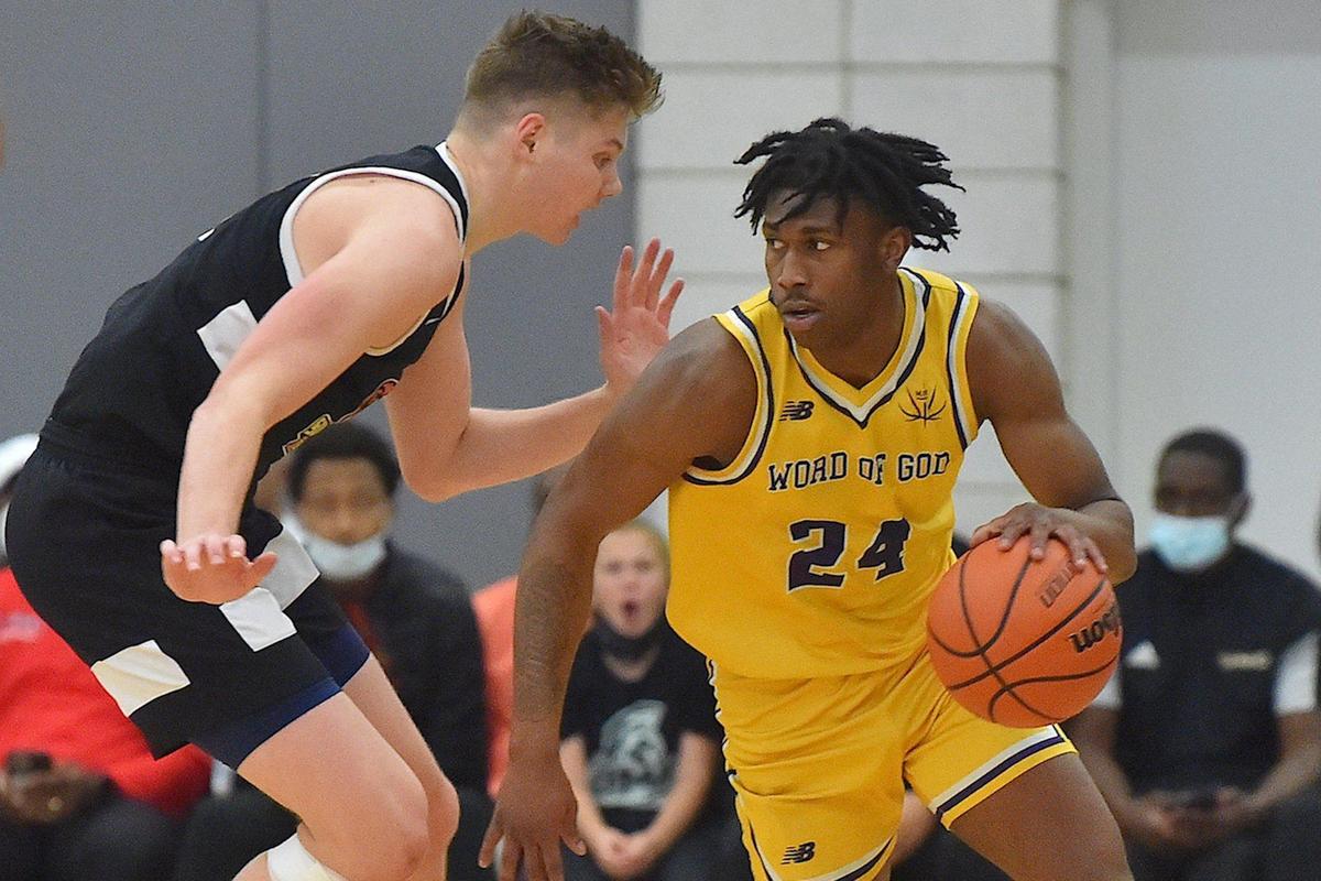 Word of God’s Jakwon Moore (9) looks to drive against Southern California’s Jaxon Kohler (0) during the first half. The Word of God Holy Rams and the Southern California Academy Rams met in the John Wall Holiday Classic in Raleigh, N.C. on December 30, 2021