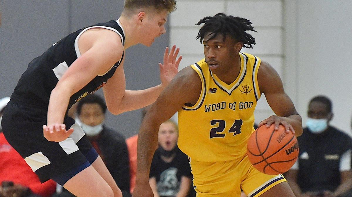 Word of God’s Jakwon Moore (9) looks to drive against Southern California’s Jaxon Kohler (0) during the first half. The Word of God Holy Rams and the Southern California Academy Rams met in the John Wall Holiday Classic in Raleigh, N.C. on December 30, 2021