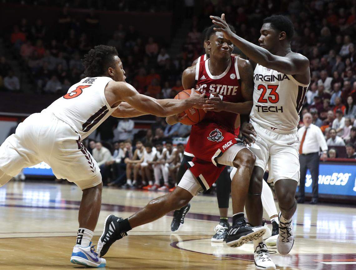 N.C. State’s Markell Johnson (11) drives as Virginia Tech’s Wabissa Bede (3) and Tyrece Radford (23) defend during the second half of Virginia Tech’s 72-58 victory over N.C. State at Cassell Coliseum in Blacksburg, VA, Saturday, Jan. 11, 2020.