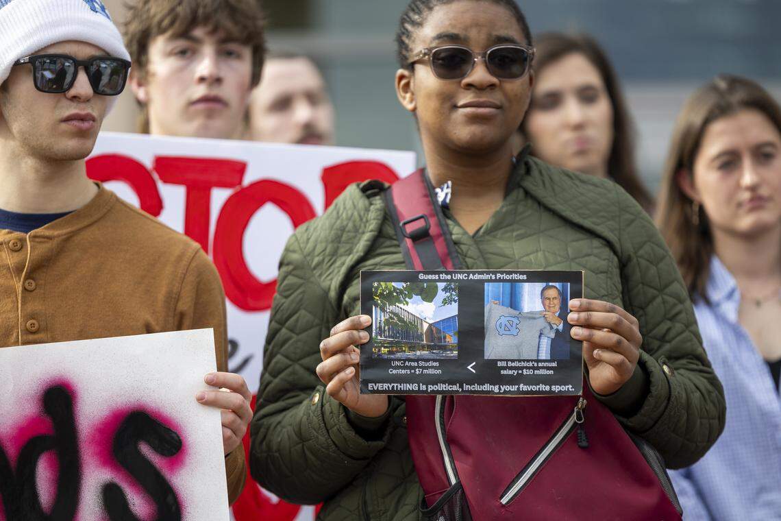 Demonstrators rally outside a UNC-Chapel Hill Board of Trustees meeting at the Spangler Center for Public Health in Chapel Hill on Thursday, Jan. 22, 2026. The board backed a surprise resolution Wednesday to cut $17 million in administrative costs, a proposal that relies in part on layoffs and further cuts to academic centers and institutes.