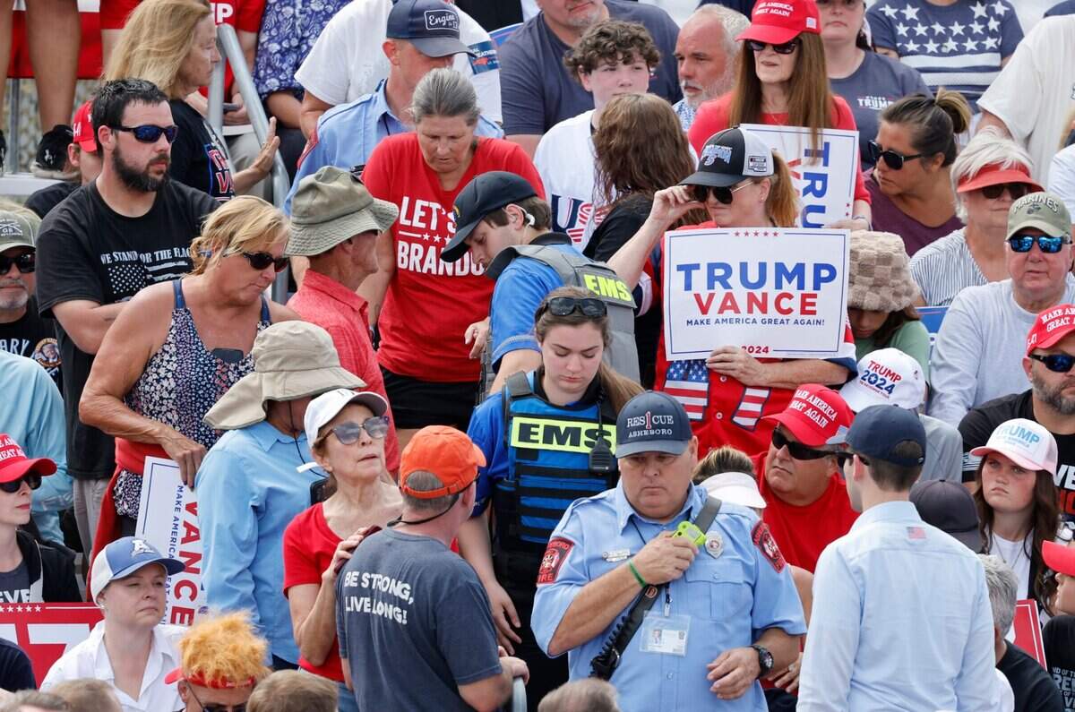 A spectator is helped out of the seating area by EMS during Republican candidate for president Donald Trump’s remarks in Asheboro, N.C., Wednesday, August 21, 2024.