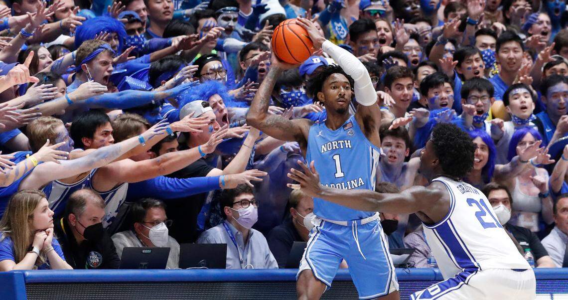 North Carolina’s Leaky Black (1) looks to inbound the ball in front of the Cameron Crazies as Duke’s A.J. Griffin (21) defends during the second half of UNC 94-81 victory over Duke at Cameron Indoor Stadium in Durham, N.C., Saturday, March 5, 2022.