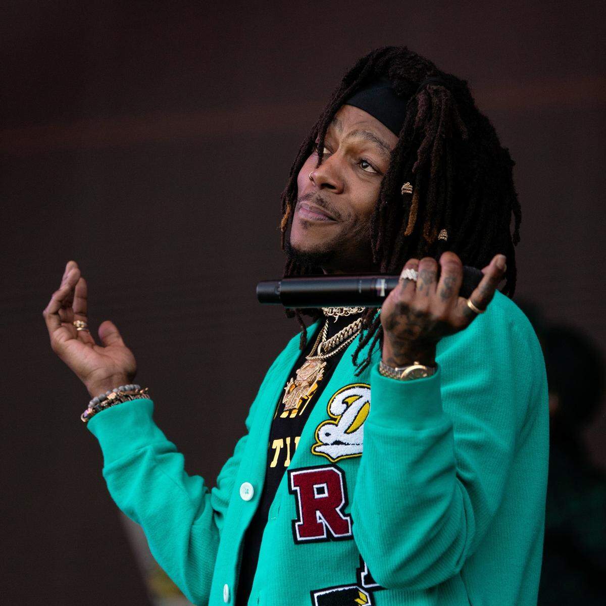 J.I.D. works the crowd during his set at the Dreamville Festival in Raleigh, N.C., Sunday, April 2, 2023.