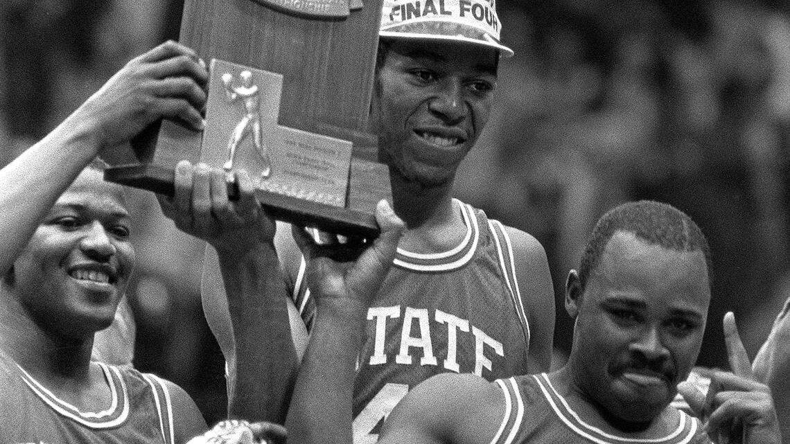 NC State's Derrick Whittenburg, left, Thurl Bailey, and Sidney Lowe hoist the 1983 NCAA Championship trophy after the Wolfpack defeated Houston to win the National championship on April 5, 1983.