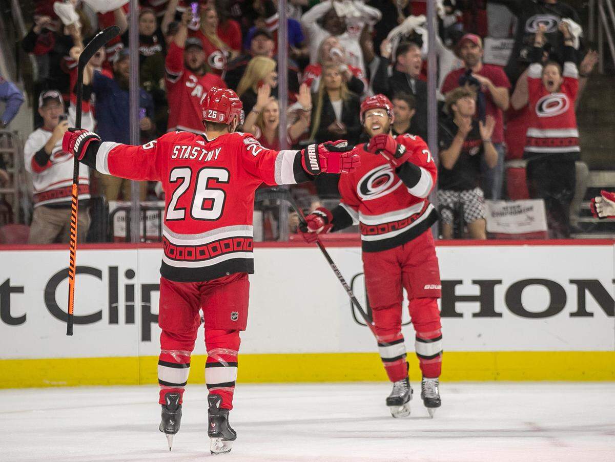 Carolina Hurricanes’ Paul Stastny (26) celebrates with teammate Jaccob Slavin (74) after scoring in the first period to take a 1-0 lead over the New York Islanders during game two of their Stanley Cup series on Wednesday, April 19, 2023 at PNC Arena in Raleigh, N.C.
