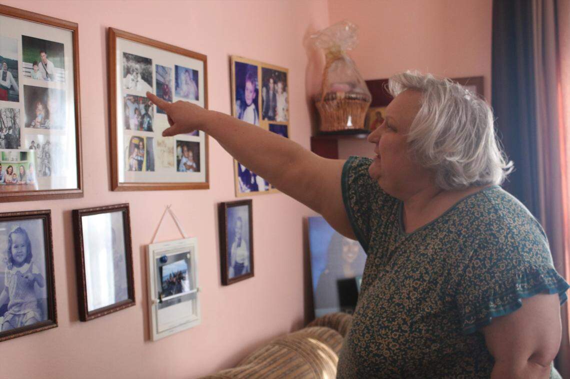 Svetlana Kivlan shows photos of family members in her Charlotte, N.C. When Russia invaded Ukraine, she worried about her brother and his family, ultimately working to bring her sister-in-law and their two children to the United States.
