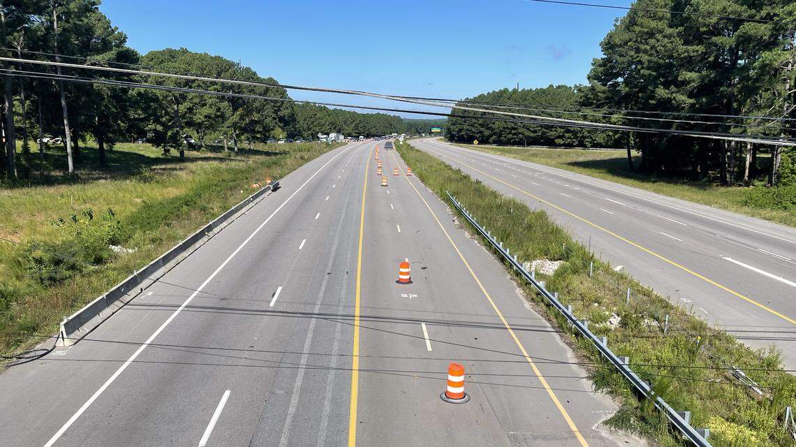 Power lines downed by Monday night’s storm drape across Wade Avenue near the Blue Ridge Road exit Tuesday morning.