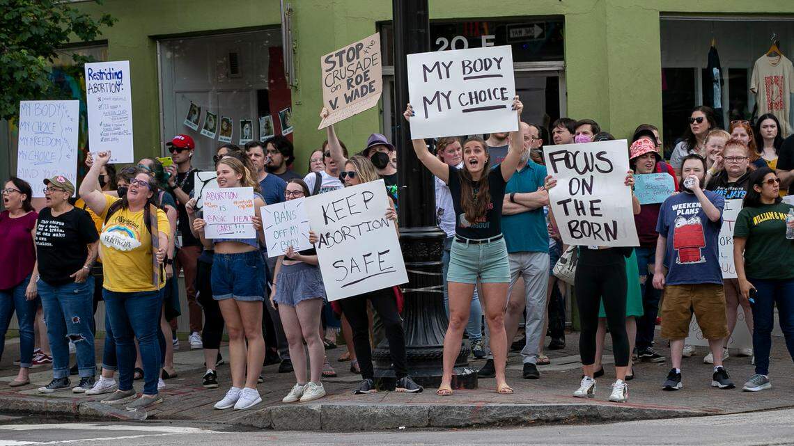 Demonstrators calling for the preservation of abortion rights gather on the corner of Hargett and Wilmington streets on Tuesday, May 3, 2022 in Raleigh.