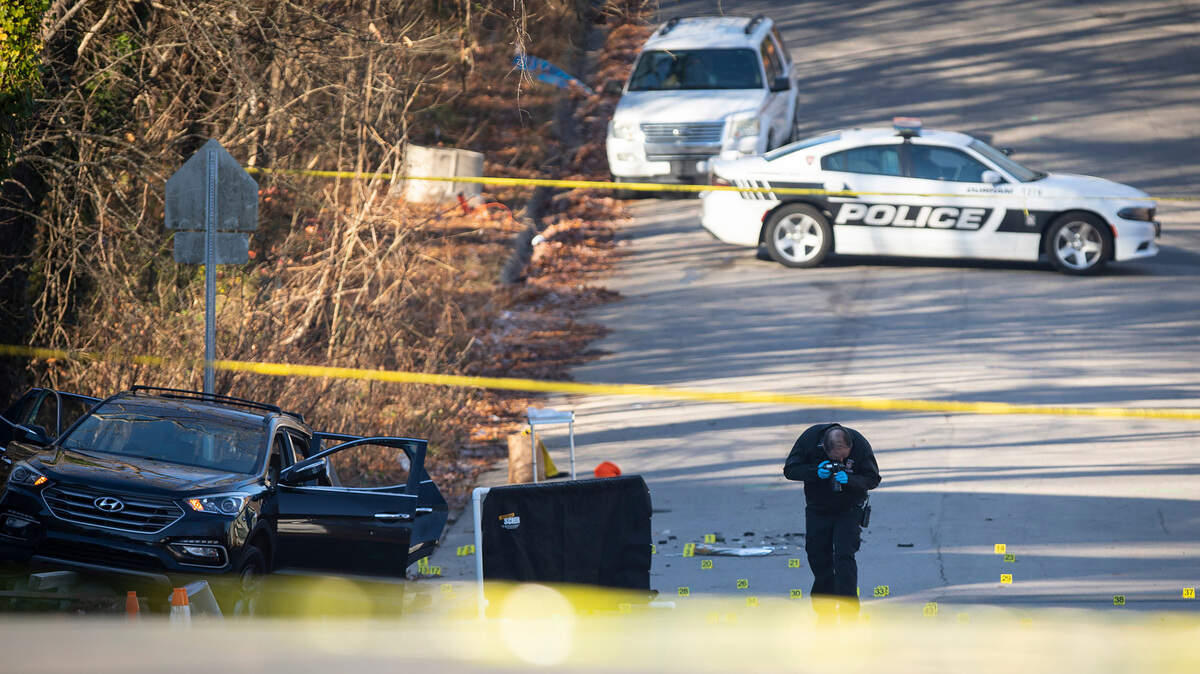 Durham police and forensics units respond on the scene of a deadly shooting in Durham, N.C. where six young people were shot, two fatally, early on Monday morning, Dec. 13, 2021.