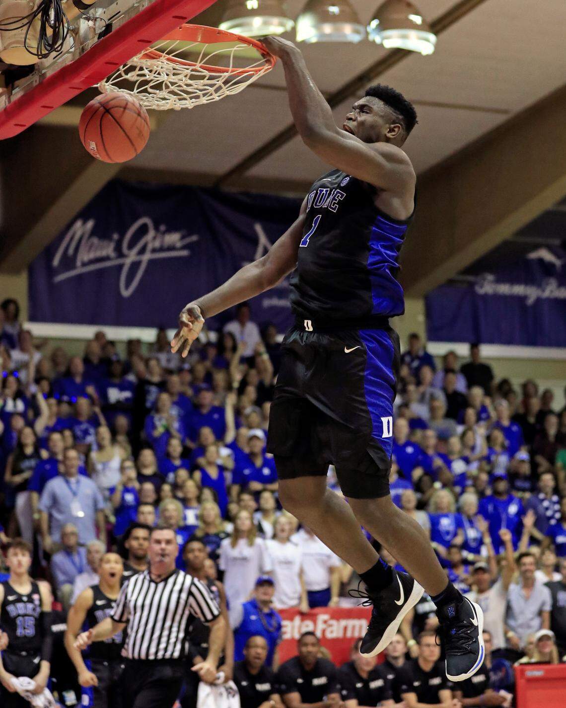 Duke forward Zion Williamson (1) slam-dunks over San Diego State during the second half of an NCAA college basketball game at the Maui Invitational, Monday, Nov. 19, 2018, in Lahaina, Hawaii.