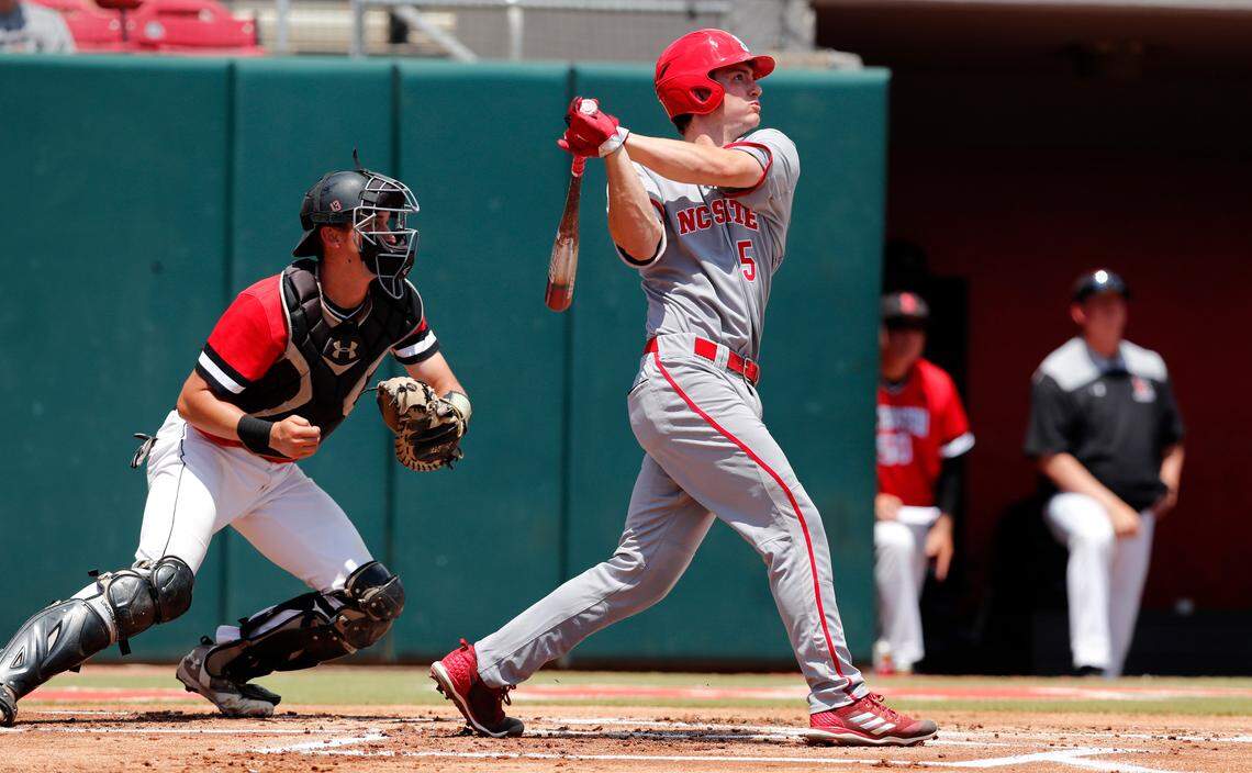 N.C. State's Patrick Bailey (5) watches after hitting a two-run home run in the first inning during the Wolfpack's 9-3 victory over Northeastern.