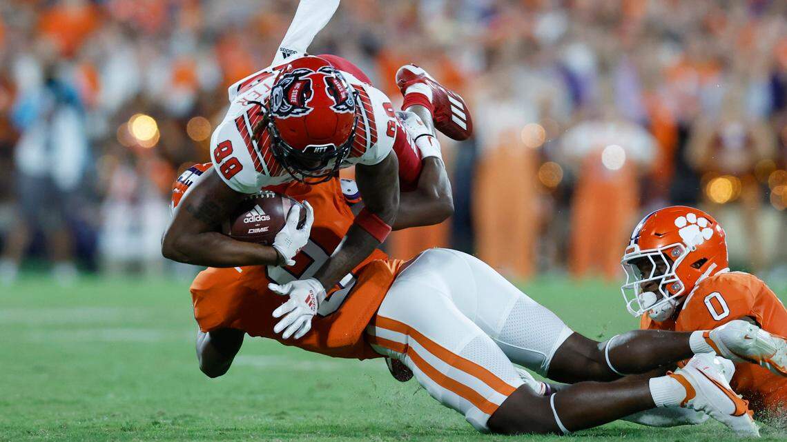 N.C. State wide receiver Devin Carter (88) is tackled by Clemson safety R.J. Mickens (9) during the second half of Clemson’s 30-20 victory over N.C. State at Memorial Stadium in Clemson, S.C., Saturday, Oct. 1, 2022.