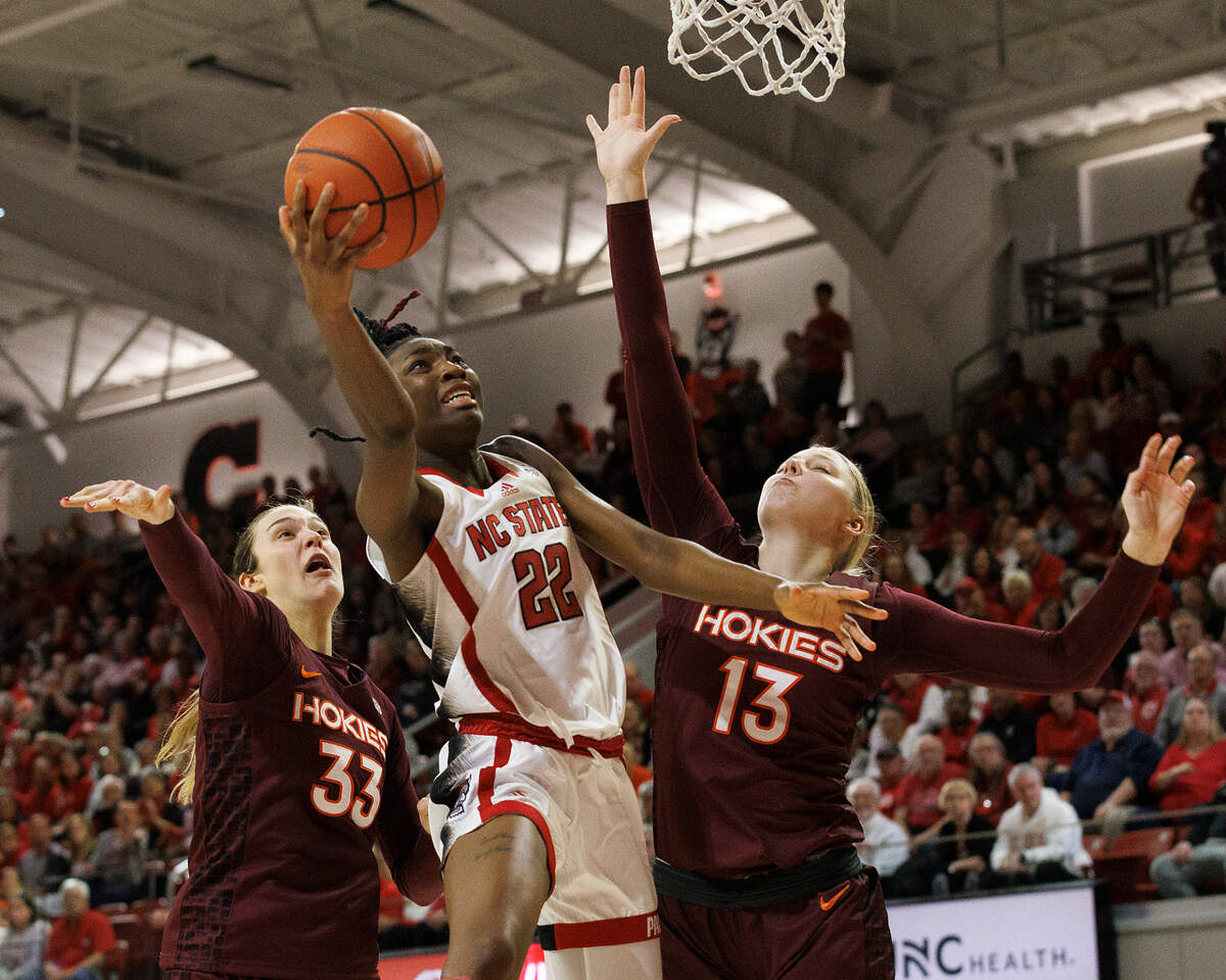 N.C. State’s Saniya Rivers drives to the basket past Virginia Tech’s Elizabeth Kitley and Clara Strack during the second half of the Wolfpack’s 72-61 loss on Thursday, Feb. 8, 2024, at Reynolds Coliseum in Raleigh, N.C.