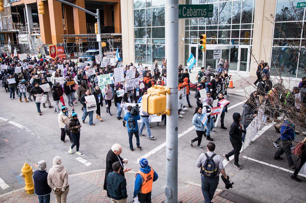 Demonstrators march down Wilmington St. during the 13th annual Moral March on Raleigh on Saturday, Feb. 9, 2019.
