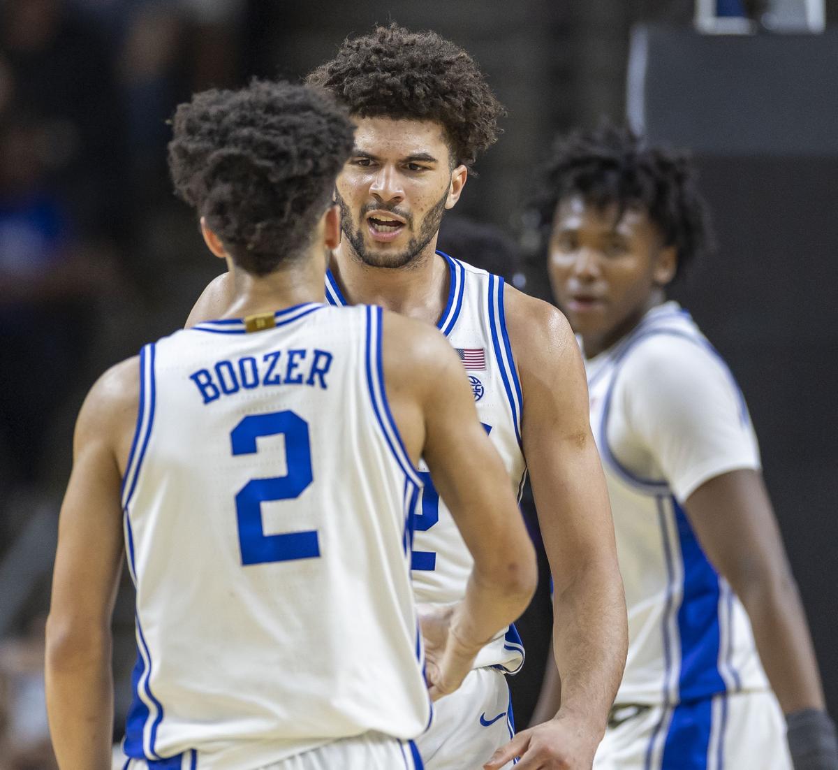 Duke forward Cameron Boozer (12) reacts with his brother Cayden Boozer (2) after a basket in the second half against TCU on Saturday, March 21, 2026, during the second round of the NCAA Tournament at Bon Secours Arena in Greenville, S.C.