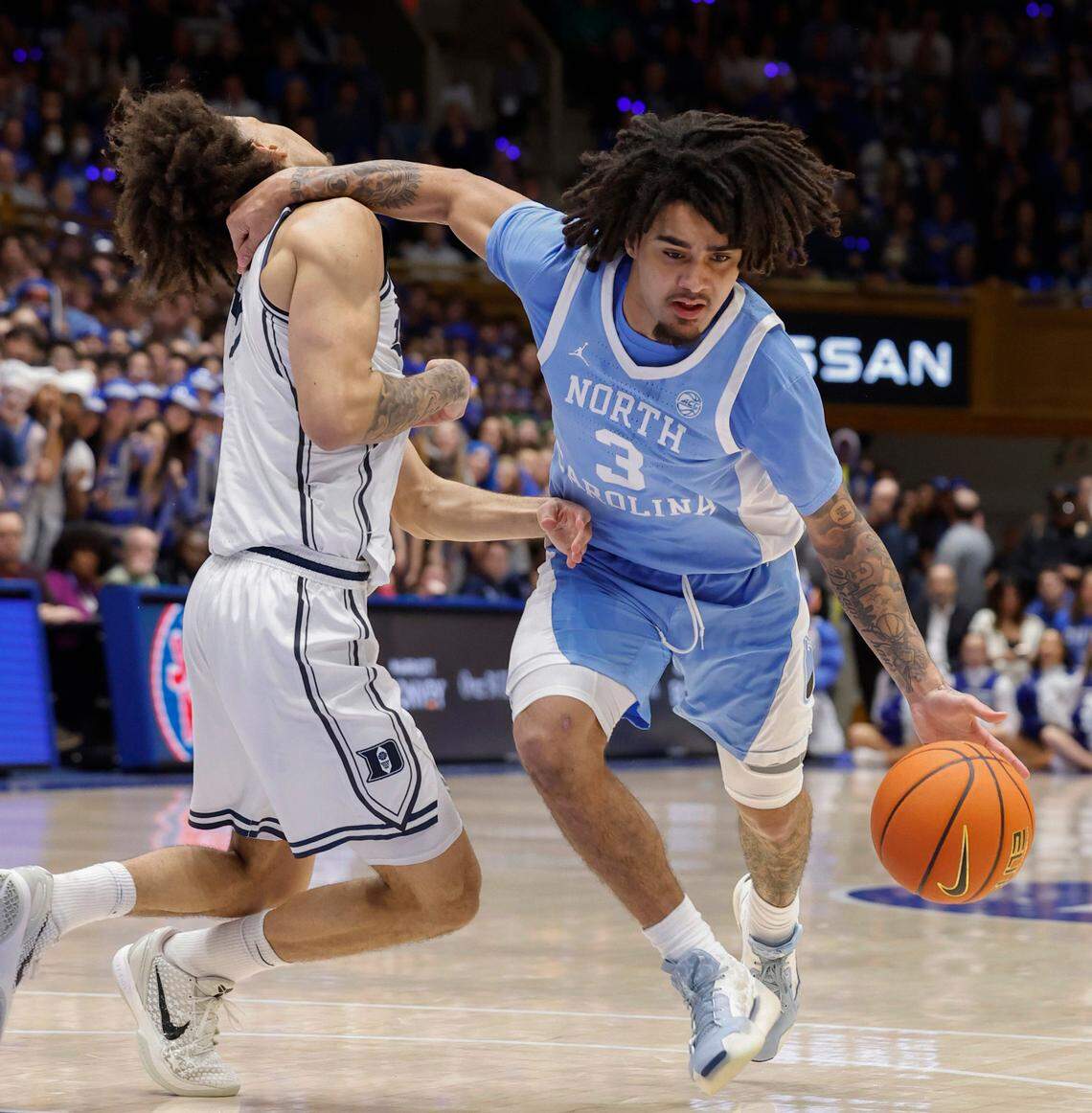 North Carolina’s Elliot Cadeau (3) is called for a flagrant foul on Duke’s Tyrese Proctor (5) during the first half of Duke’s game against UNC at Cameron Indoor Stadium in Durham, N.C., Saturday, Feb. 1, 2025.