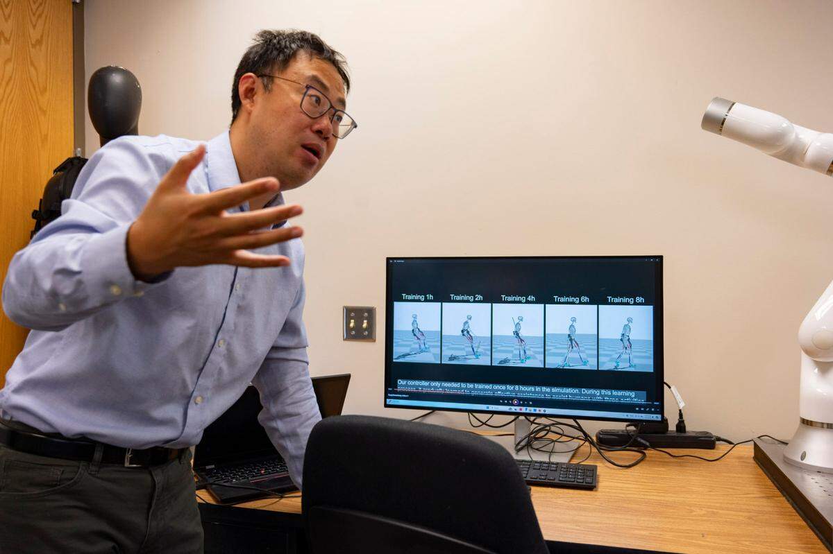 Dr. Hao Su explains the simulation for versatile activities and the research being the AI robotic exoskeleton at the Biomechatronics and Intelligent Robotics Lab at N.C. State in Raleigh on Monday, July 1, 2024.