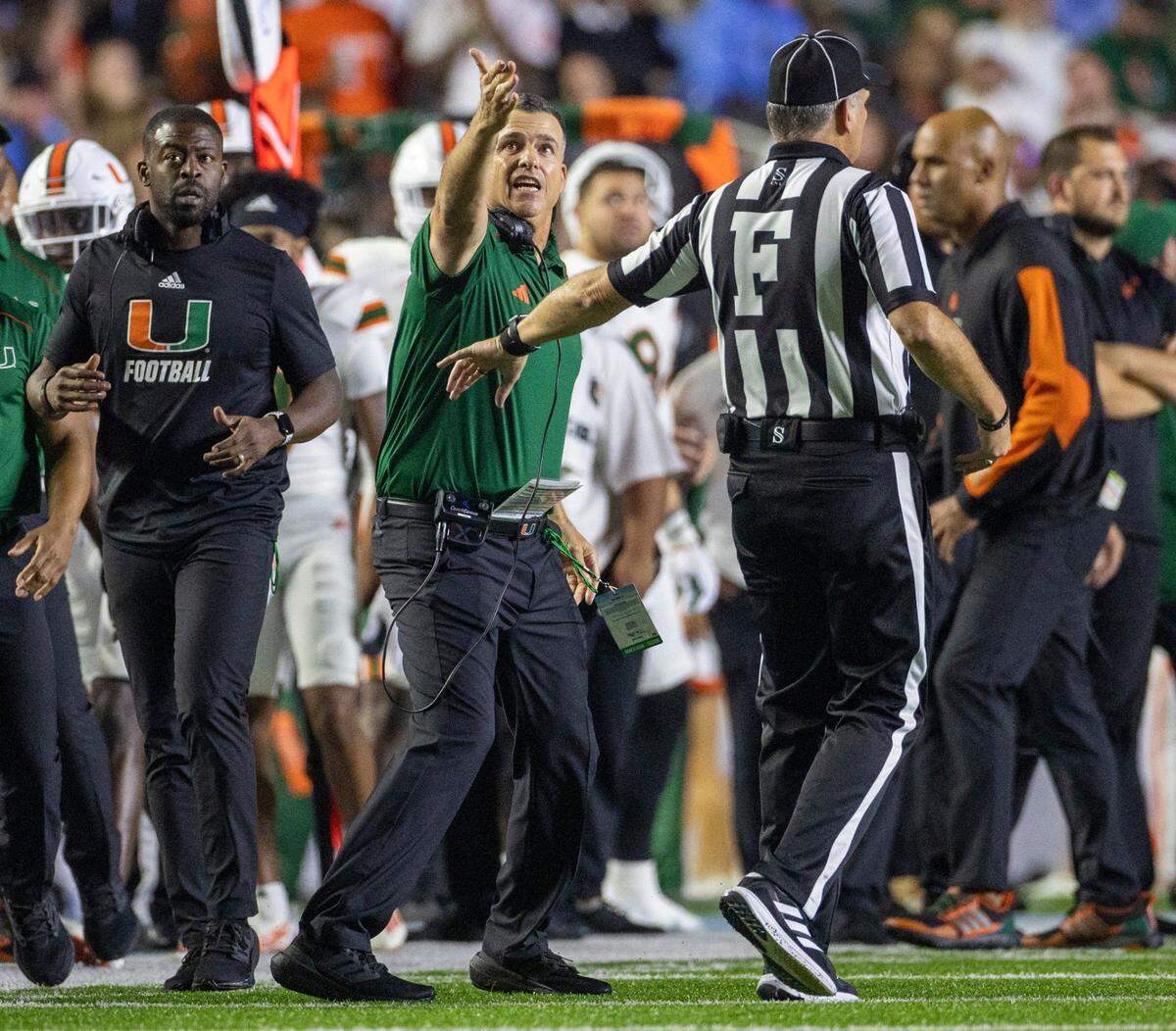 Miami coach Mario Cristobal questions a call by the officials in the second quarter against North Carolina on Saturday, October 14, 2023 at Kenan Stadium in Chapel Hill, N.C.