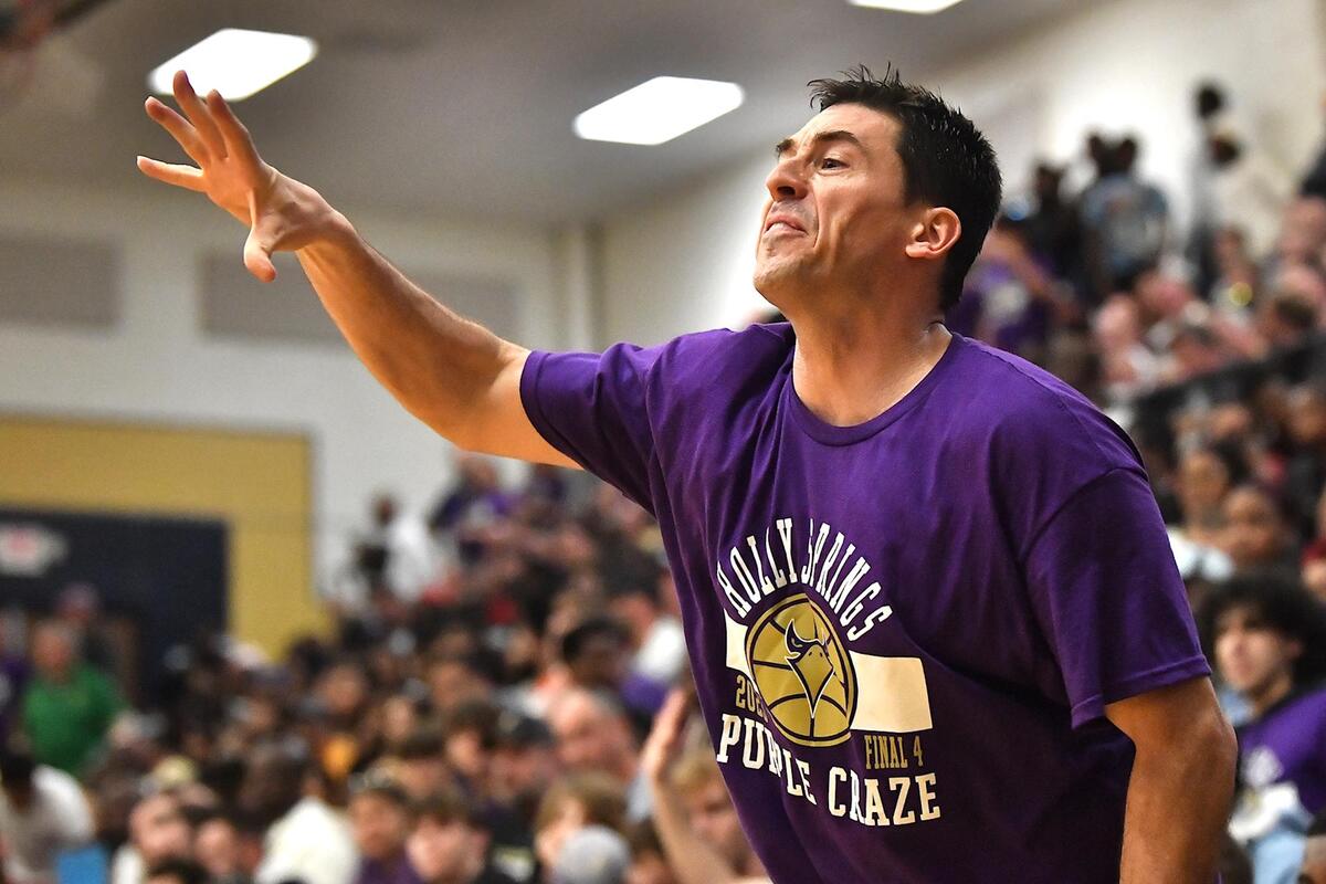 Holly Springs Head Coach L.J. Hepp gives direction to his team during the second half. The Richmond Raiders and the Holly Springs Golden Hawks met in the NCHSAA 4A East Regional Finals in Sanford, N.C. on March 4, 2023.