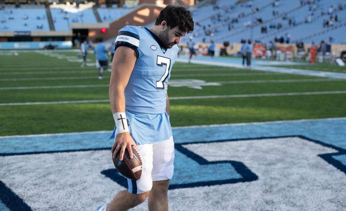 North Carolina quarterback Sam Howell (7) leaves the field with the game ball after a record setting performance against Wake Forest. Howell completed 32 of 45 passes for 550 yards and 6 touchdowns in the Tar Heels; 59-53 victory.
