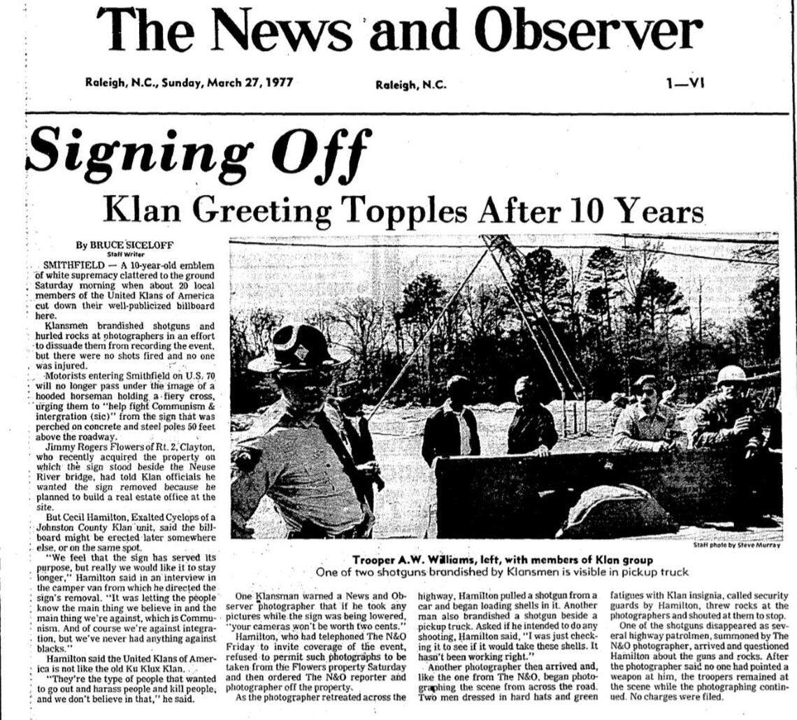 An article in The News & Observer on March 27, 1977, about the removal of the “Klan Country” sign outside Smithfield in Johnston County.