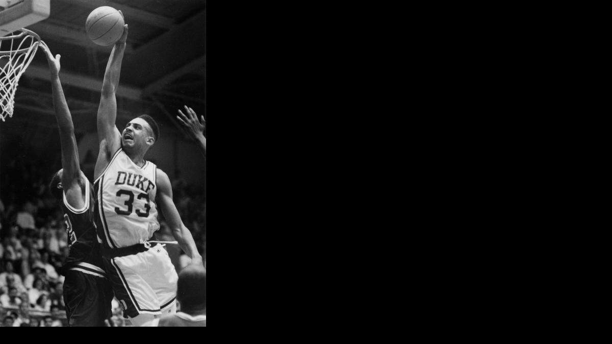 Duke's Grant Hill flies toward the basket for a dunk during an exhibition game against America High Five Nov 16, 1991.
